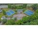 Aerial view of community center with tennis courts, pool, parking, and mature trees at 148 Shady View Pl, Lawrenceville, GA 30044