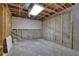 Unfinished basement featuring concrete floor, exposed wooden framing, and utility hookups at 148 Shady View Pl, Lawrenceville, GA 30044