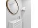 Bathroom with a floating vanity, modern sink, decorative mirror, and an automatic hand dryer at 148 Shady View Pl, Lawrenceville, GA 30044