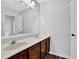 Bathroom with double sink vanity, wood-look floor, and neutral walls at 148 Shady View Pl, Lawrenceville, GA 30044