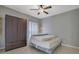 Small bedroom includes a closet, ceiling fan, and natural light at 148 Shady View Pl, Lawrenceville, GA 30044