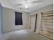 Empty bedroom with gray walls and carpet featuring a ceiling fan at 148 Shady View Pl, Lawrenceville, GA 30044