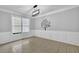 Dining room with wainscoting, tile flooring, and a modern chandelier at 148 Shady View Pl, Lawrenceville, GA 30044