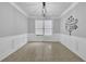 Dining area featuring tile floors, white trim, modern lighting, and natural light at 148 Shady View Pl, Lawrenceville, GA 30044