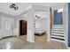 Open entryway featuring tile floors, stairway, and views into an additional room at 148 Shady View Pl, Lawrenceville, GA 30044