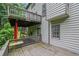 Side view of exterior elevated wood deck with railings and supports, adjacent to lush greenery at 148 Shady View Pl, Lawrenceville, GA 30044