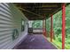 Mulched area under deck featuring red support beams and views of a fenced-in yard at 148 Shady View Pl, Lawrenceville, GA 30044