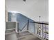 Hallway with wooden floors, black railings, grey walls, and view of rooms below at 148 Shady View Pl, Lawrenceville, GA 30044