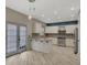 Modern kitchen features stainless steel appliances, white cabinets, an island and exterior access at 148 Shady View Pl, Lawrenceville, GA 30044