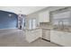 This stylish kitchen includes stainless steel appliances, granite counters, tile backsplash and opens into a bright living space at 148 Shady View Pl, Lawrenceville, GA 30044