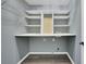 Laundry room with shelving and gray walls at 148 Shady View Pl, Lawrenceville, GA 30044