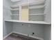 Laundry room featuring an abundance of white shelving and gray walls at 148 Shady View Pl, Lawrenceville, GA 30044