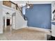 Bright living room with vaulted ceilings, tile floors, fireplace, and stairway at 148 Shady View Pl, Lawrenceville, GA 30044