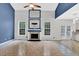 Bright living room with vaulted ceilings, tile floors, fireplace, and backyard views at 148 Shady View Pl, Lawrenceville, GA 30044
