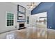 Bright living room with vaulted ceilings, tile floors, fireplace, and backyard views at 148 Shady View Pl, Lawrenceville, GA 30044