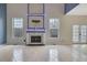 Spacious living room with a fireplace, large windows, and tile flooring at 148 Shady View Pl, Lawrenceville, GA 30044