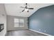 Spacious living room with hardwood floors, vaulted ceiling, and modern fireplace at 148 Shady View Pl, Lawrenceville, GA 30044