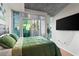 Serene bedroom with balcony access, natural light, and city views at 250 Pharr Ne Rd # 607, Atlanta, GA 30305