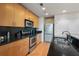 Spacious kitchen featuring stainless steel appliances, sleek cabinetry, and granite countertops at 250 Pharr Ne Rd # 607, Atlanta, GA 30305