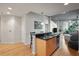Open kitchen featuring a breakfast bar, black backsplash, and stainless steel appliances at 250 Pharr Ne Rd # 607, Atlanta, GA 30305