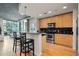 Modern kitchen with stainless steel appliances, granite countertops, and breakfast bar at 250 Pharr Ne Rd # 607, Atlanta, GA 30305