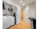 Laundry room with washer, dryer, and shelving for storage and organization at 250 Pharr Ne Rd # 607, Atlanta, GA 30305