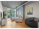 Cozy living room with large windows, modern furniture, and plenty of natural light at 250 Pharr Ne Rd # 607, Atlanta, GA 30305