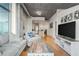 Open-concept living room with lots of natural light, sleek decor, and hardwood flooring at 250 Pharr Ne Rd # 607, Atlanta, GA 30305