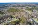 An aerial view of a residential neighborhood filled with a mix of trees and houses at 322 Berkshire Trce, Canton, GA 30115