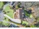 Top-down shot showcasing backyard patio, fire pit, and manicured lawn at 322 Berkshire Trce, Canton, GA 30115