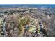 Beautiful aerial view of houses nestled into wooded lots in a lovely neighborhood at 322 Berkshire Trce, Canton, GA 30115