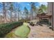 Backyard features a fire pit, seating and meticulous landscaping at 322 Berkshire Trce, Canton, GA 30115