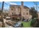 Expansive backyard featuring a deck, fire pit, waterfall, and lush landscaping at 322 Berkshire Trce, Canton, GA 30115