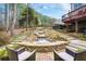 Beautiful stone waterfall feature and outdoor seating create a relaxing backyard oasis at 322 Berkshire Trce, Canton, GA 30115
