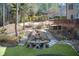 Beautifully landscaped backyard with tiered stone steps, a waterfall, and an inviting lawn at 322 Berkshire Trce, Canton, GA 30115