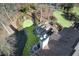 Unique backyard with a fireplace, putting green, pond, and outdoor seating area at 322 Berkshire Trce, Canton, GA 30115