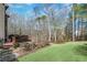 Expansive backyard with well-maintained lawn and wooded area, perfect for outdoor enjoyment at 322 Berkshire Trce, Canton, GA 30115