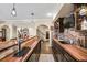 Full basement bar with stone accents, wood countertop, sink, and beer taps at 322 Berkshire Trce, Canton, GA 30115