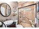 The bathroom features a modern glass enclosed shower, stylish vanity and fixtures at 322 Berkshire Trce, Canton, GA 30115
