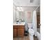 Standard bathroom featuring a vanity, toilet, and shower-tub combination with tiled accents at 322 Berkshire Trce, Canton, GA 30115