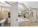 A bathroom features a glass shower and a white toilet at 322 Berkshire Trce, Canton, GA 30115
