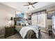 Comfortable bedroom featuring a ceiling fan, bedside tables and a patterned bedspread at 322 Berkshire Trce, Canton, GA 30115