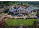 Upscale clubhouse with lush landscaping, golf carts, and manicured lawns at 322 Berkshire Trce, Canton, GA 30115