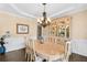Formal dining room features hardwood floors, chandelier, and detailed trim work at 322 Berkshire Trce, Canton, GA 30115