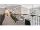 A spacious hallway with dark metal railings and a view of the home's lower level at 322 Berkshire Trce, Canton, GA 30115