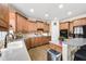 Functional kitchen with wood cabinets, an island, and modern appliances at 322 Berkshire Trce, Canton, GA 30115