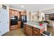 Stylish kitchen with stainless steel appliances, wood cabinets, and island counter at 322 Berkshire Trce, Canton, GA 30115