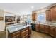 Bright kitchen showcasing wood cabinetry, hardwood floors, and an open layout at 322 Berkshire Trce, Canton, GA 30115