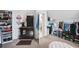 Spacious walk-in closet with coffee bar, mini-fridge, laundry area, and custom storage system for shoes and accessories at 322 Berkshire Trce, Canton, GA 30115