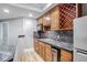 Basement bar features granite countertops and wood cabinetry at 409 Angier Ne Ct, Atlanta, GA 30312